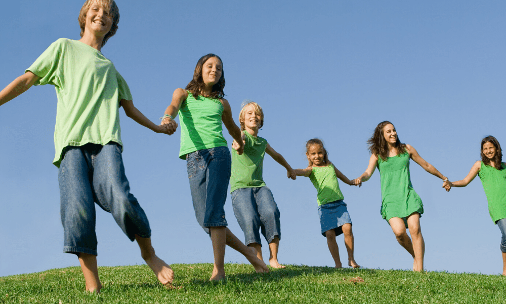 kids holding hands in a row