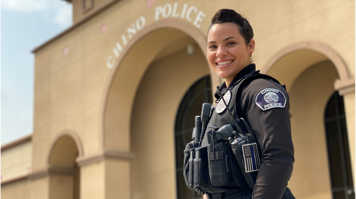 Chino Police Officer Jessica Asbee posing in front of the Chino Police Department.
