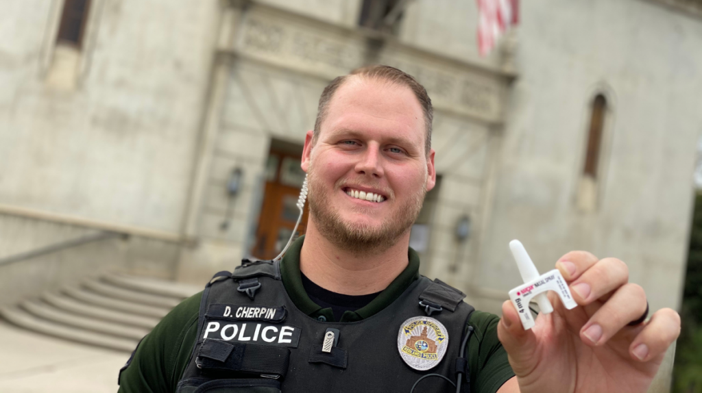 Officer Daniel Cherpin holds a Narcan applicator