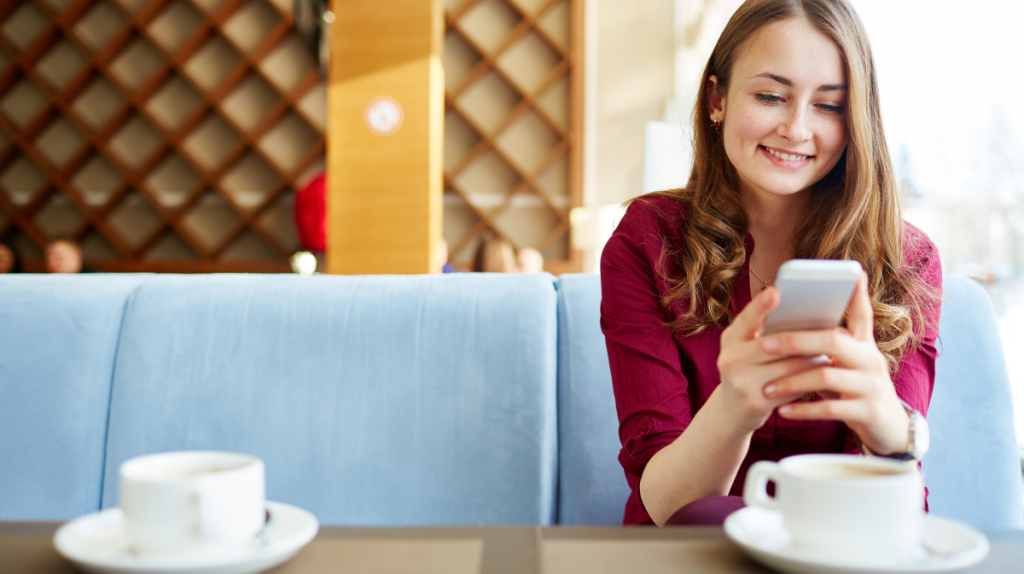 Woman using public WiFi in a coffee shop